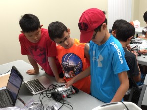 Kids at JEI starting their first robot.